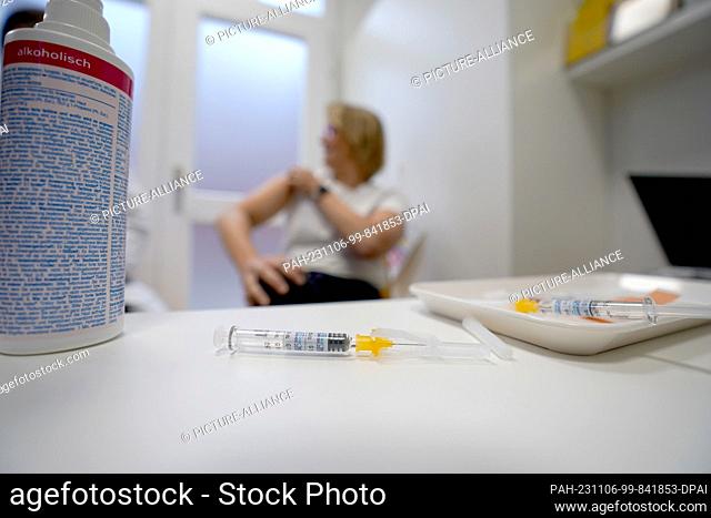 06 November 2023, Hamburg: A syringe with the Influvac Tetra flu vaccine lies on a table in a treatment room in the vaccination center at the Institute for...