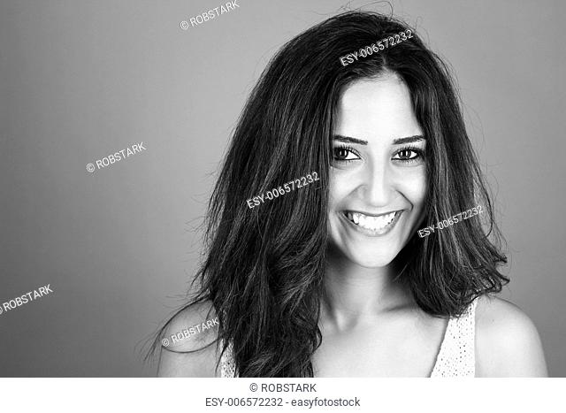 black and white portrait of a happy brunette woman