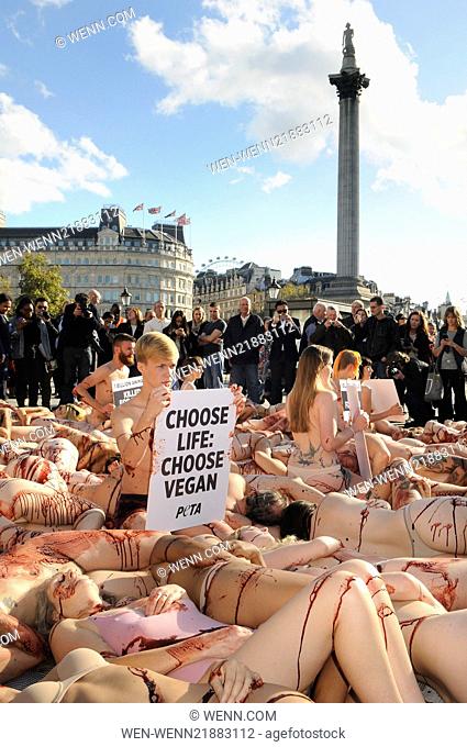In recognition of World Vegan Day, approximately 100 PETA supporters lie nearly naked in Trafalgar Square to encourage passers by to have compassion for animals...