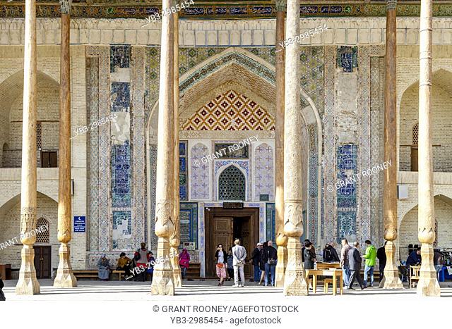 A Group Of Tourists Visiting The Bolo Hauz Mosque, Bukhara, Uzbekistan