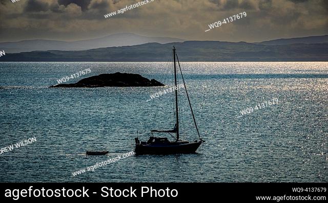A lone yacht off the coast of Coll, Scotland