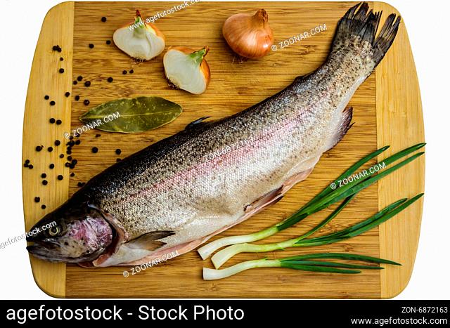 Fresh Salmon trout with bay leaf, black pepper and onion isolated