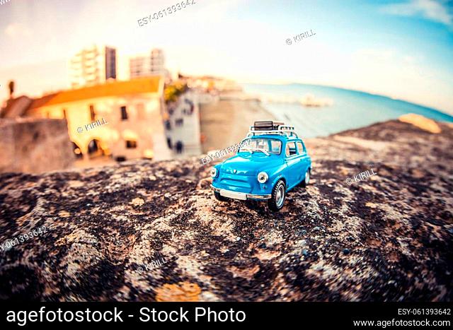 Miniature travelling car with luggage on a roof. Macro photography