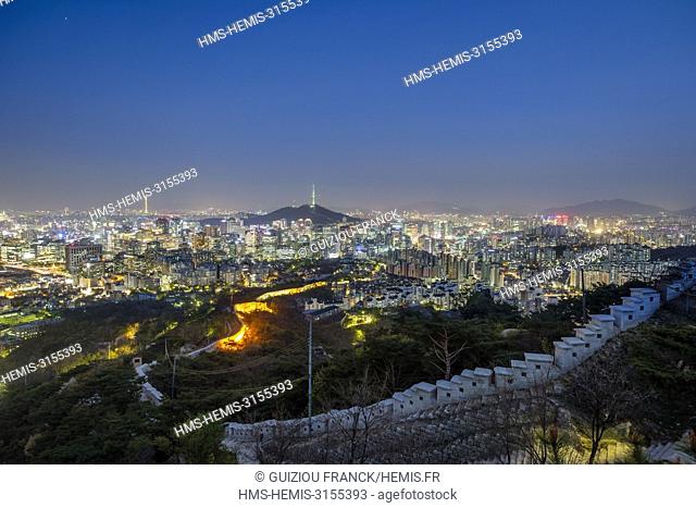 South Korea, Seoul, Seoul City Wall on Mount Inwang, series of walls built by King Taejo in 1396 ; the N Seoul Tower in the background