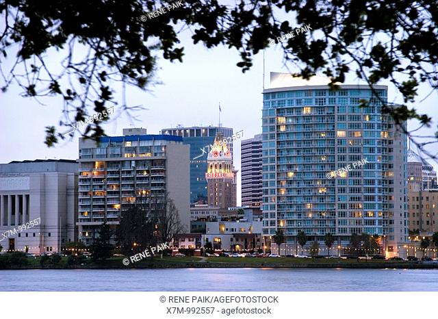 View of the landmark Oakland Tribune building from across Lake Merritt on a stormy day  Lake Merritt is refered to as the Jewel of Oakland  It's the largest...