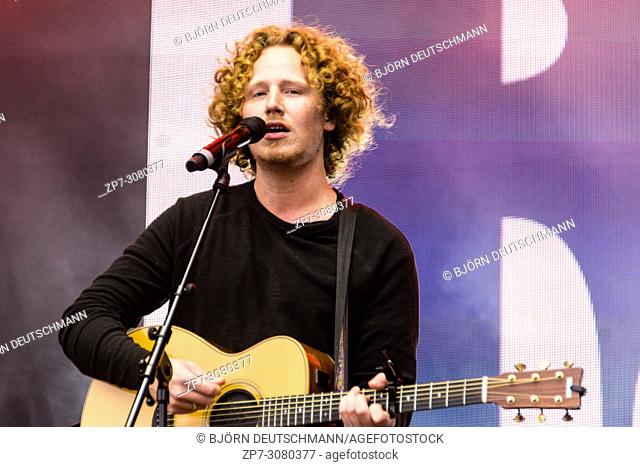 Kiel, Germany - June 24, 2018: Singer-Songwriter and ESC-Participant Michael Schulte is performing on the Hörnbühne during the Kieler Woche 2018