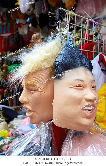 19 March 2018, China, Hong Kong: Masks of Donald Trump, President of the United States (USA, L) and Dictator Kim Jon Un (North Korea) hang together in a...