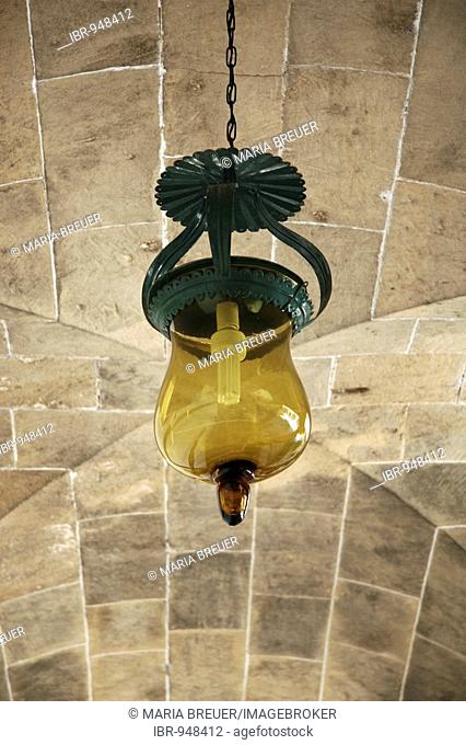 Energy saving lamp built into an old lantern, cloister, inner courtyard, La Seu Cathedral, Palma de Mallorca, Majorca, Balearic Islands, Spain, Europe