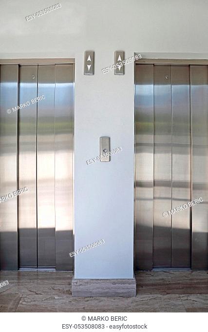 Closed Elevators Doors at Two Modern Lifts