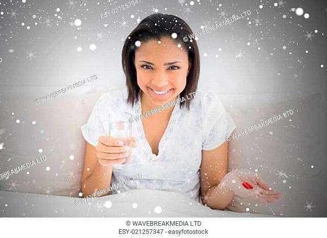 Composite image of content young dark haired model taking medication