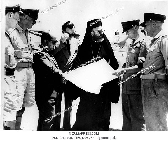 Date Unknown - Nicosia, Cyprus - ARCHBISHOP MAKARIOS III and the Colonial Secretary JULIAN AMERY look at maps to locate the boundaries of British bases in the...