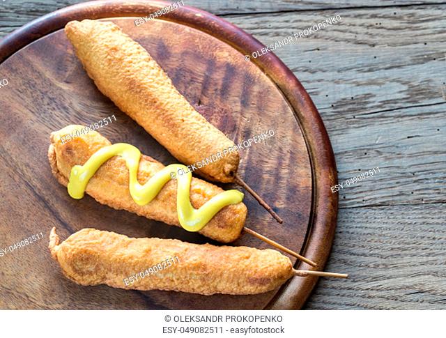 Corn dogs on the wooden board