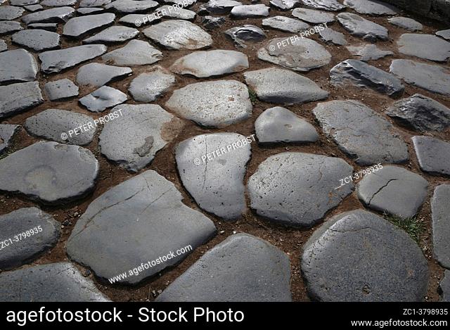 Ancient cobblestones at the Colosseum in Rome - Italy