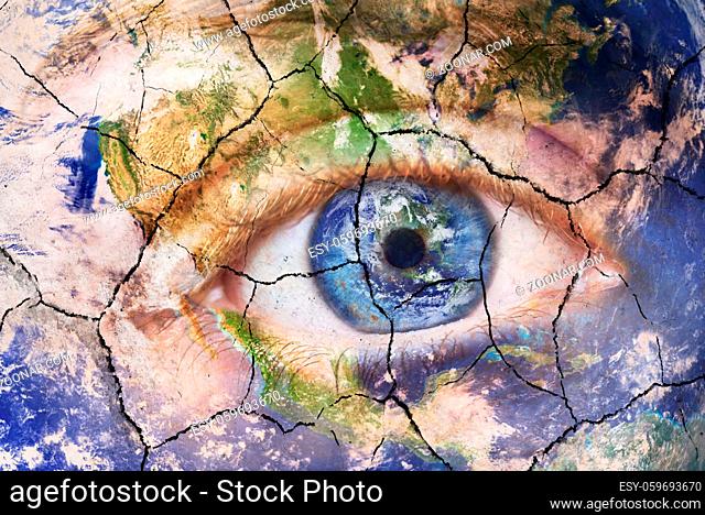 Earth extinction concept. Close up image of woman face with earth painted, cracked texture with iris earth. Creative composite of macro Eye with Earth as Iris