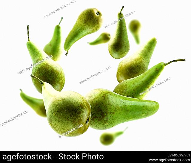 Green pears levitate on a white background