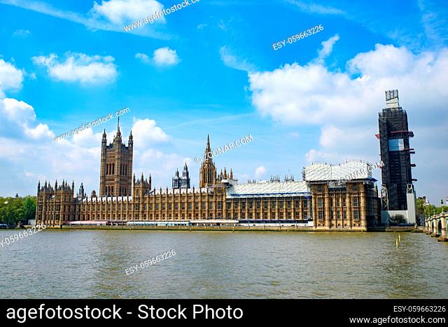 The Palace of Westminster as the Houses of Parliament on the north bank of the River Thames in London, United Kingdom