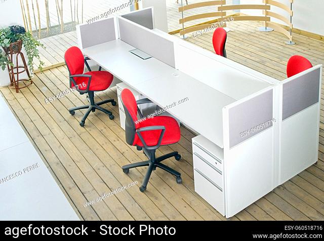 office desks and red chairs cubicle set view from top over wood flooring