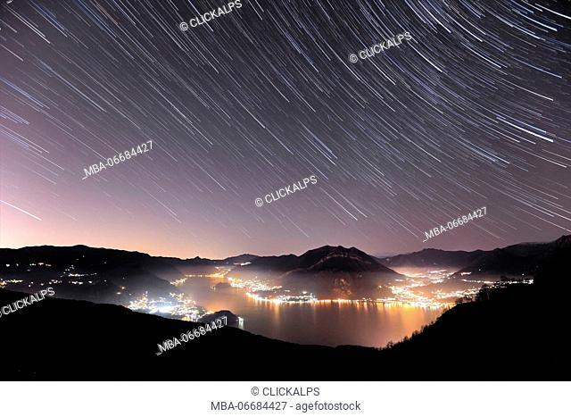 Star trail on Lago di Como, from Esino Lario, Province of Lecco, Lombardy, Italy