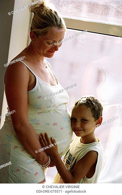 Pregnant woman and little boy