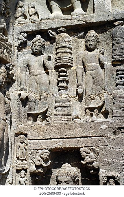 Ajanta, Right portion of Facade of Cave No. 19 showing Standing Buddha's in Varada mudra with votive stupas in center. Ajanta Caves, Aurangabad, Maharashtra