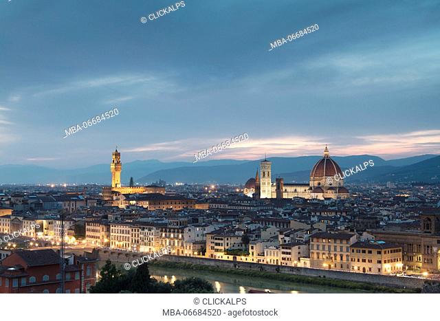 The blue light of dusk frames the city of Florence crossed by Arno River seen from Piazzale Michelangelo Tuscany Italy Europe