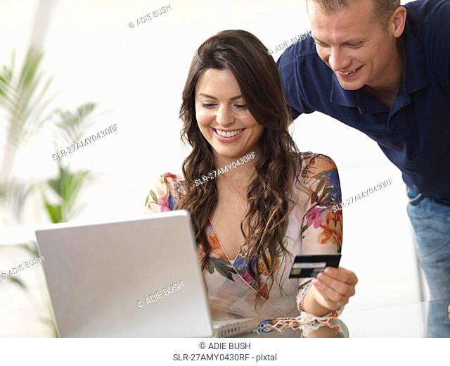 Couple at home shopping online