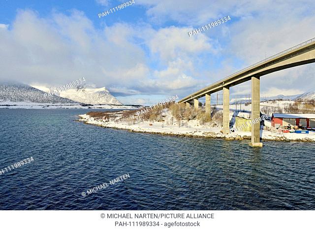 Piers from the Andøy Bridge by the small village Risoyhamn in the winterly white landscape of Vesterålen, 10 March 2017 | usage worldwide