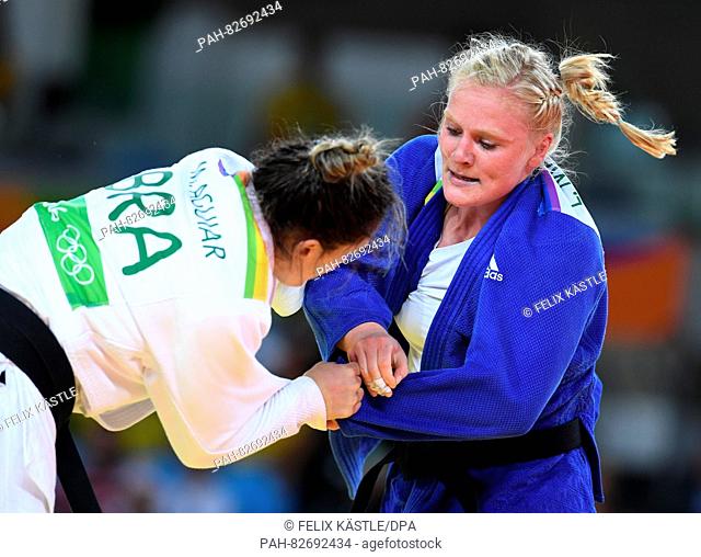 Luise Malzahn of Germany (blue) in action against Mayra Aguiar of Brazil in action during the Women -78 kg Quarterfinal of the Judo events during the Rio 2016...