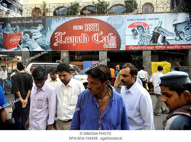 People outside the Leopold Cafe ; after terrorist attack by Deccan Mujahideen on 26th November 2008 in Bombay Mumbai ; Maharashtra ; India NO MR