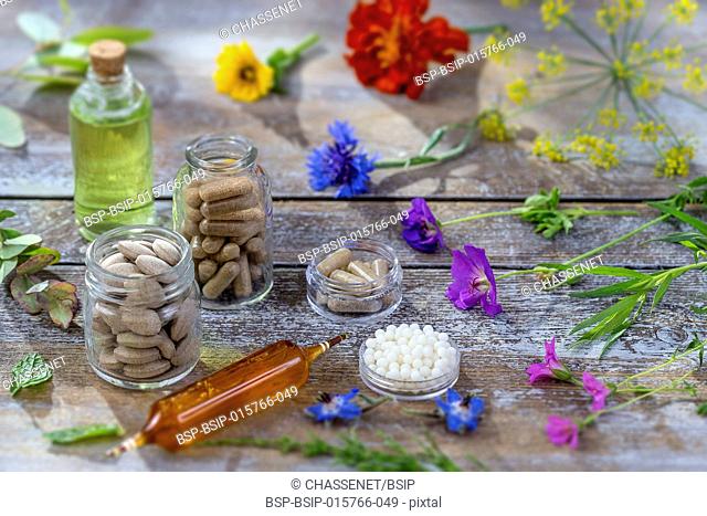 Alternative herb medicine. herbal vitamin on wooden board