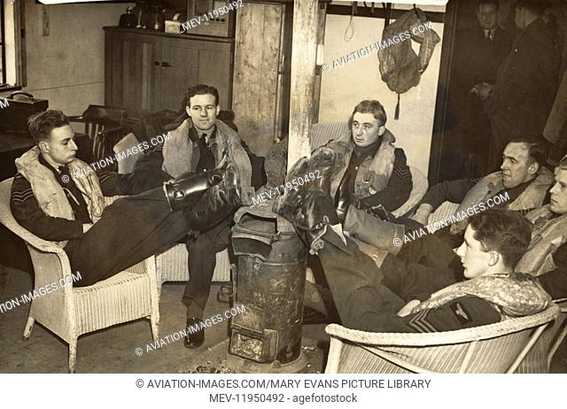 The 'Tiger' Squadron - a Group of RAF Sergeant Pilot Resting Their Feet on a Hot Stove after the The Battle-Of-Britain Waiting for the Next Call to Action -...