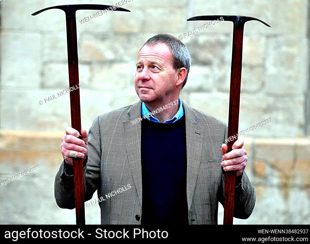 Nick Bowkett, Director/Auctioneer at Stroud Auction Rooms in Gloucestershire, with ice axes used by Theodore Howard Somervell, OBE, FRCS (British 1890-1975)