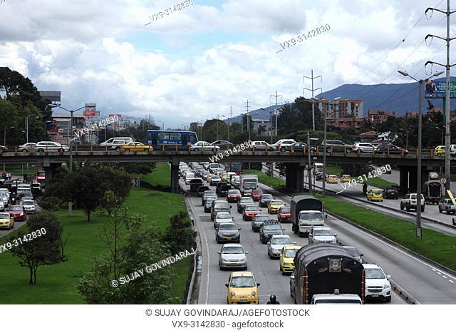 Bogota, Colombia - The traffic on the Southbound carriageway is virtually bumper to bumper. The Bridge across the Autopista leads to Calle 127 is also packed...