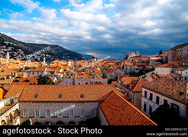 View over the old city Dubrovnik with mountains and sunny dramatic cloudscape, Croatia