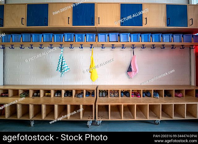 16 March 2020, Bremen: An empty wardrobe in a daycare center. In order to slow down the spread of the corona virus, all schools and daycare centres in Bremen...