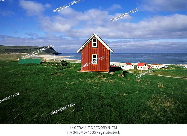 Iceland, Westfjords, Vestfirdir Region, Breidafjordur Bay, Hvallatur Island, red house in sheet steels in front of the beach