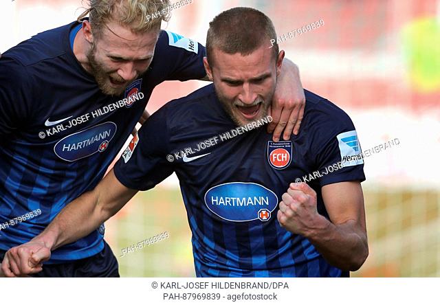 Heidenheim's Sebastian Griesbeck (l) and Timo Beermann celebrate the 1:0 goal during the 2nd Bundesliga soccer match between Wuerzburger Kickers and 1