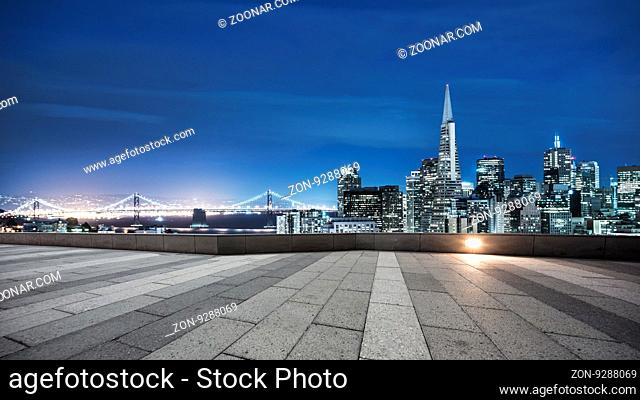 empty pavement with cityscape and skyline of san francisco at twilight