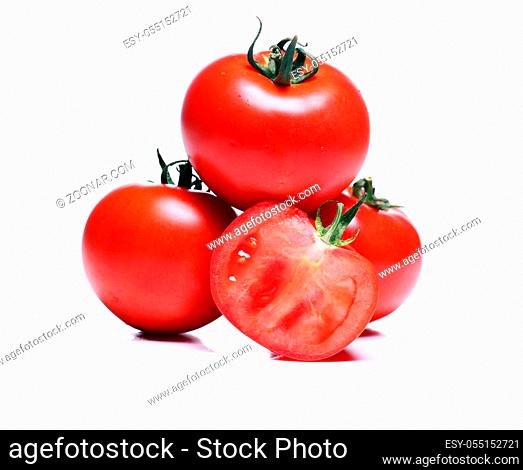 Close up of fresh tomatoes over white background