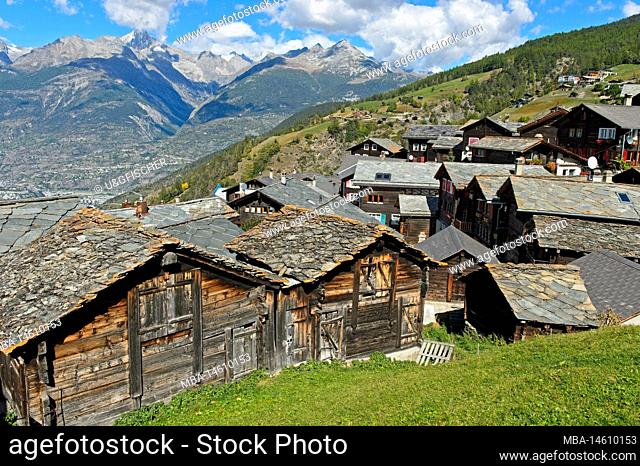 View over the mountain village Visperterminen with its stone-roofed storehouses, Visperterminen, Valais, Switzerland