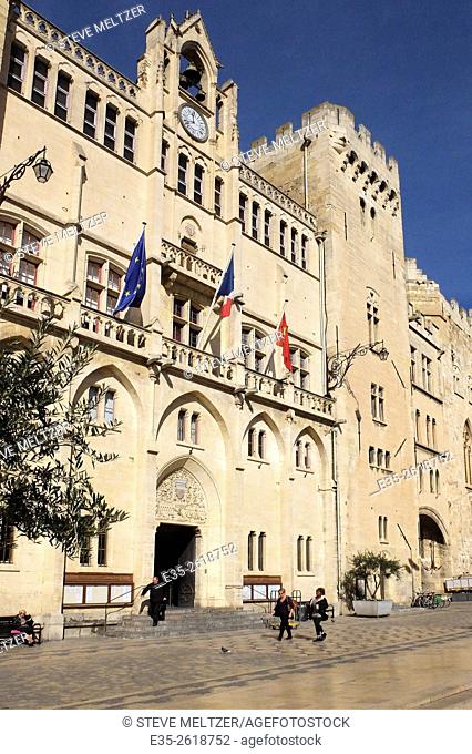 The Historic heart of the city of Narbonne, France in front of the Hotel de Ville. The facade was constructed between 1846-1852 in the Troubador style