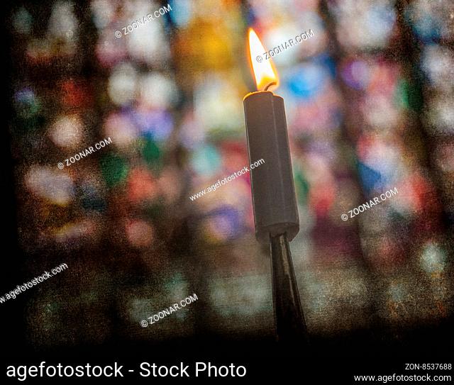 Candle burning inside an old Catholic church - Vintage dirty look