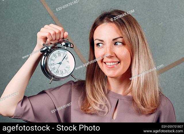 Business woman young adult coach with clock watch at office portrait. Time management concept