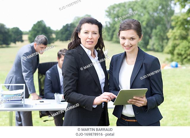 Business people working together outdoors