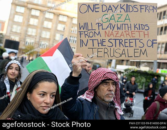 03 November 2023, Hesse, Frankfurt/Main: An elderly man holds a poster with the words ""One day, kids from Gaza will play with kids from Nazareth in the streets...