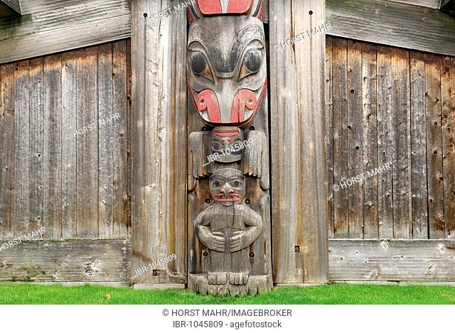 Totem pole integrated in a longhouse, Royal BC Museum, Victoria, British Columbia, Canada, North America