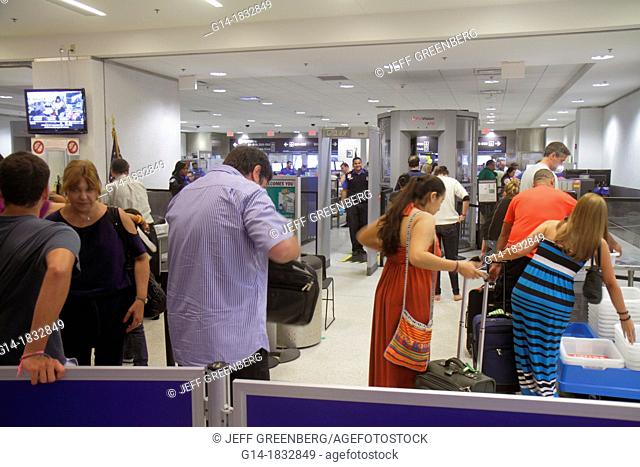Florida, Miami, Miami International Airport, MIA, security check, checkpoint, body scanner, TSA, Transportation Security Administration, passengers, man, woman