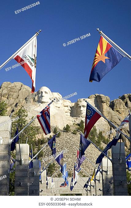 Fifty State flags lining the walkway to Grand Terrace view of Mount Rushmore National Memorial, South Dakota