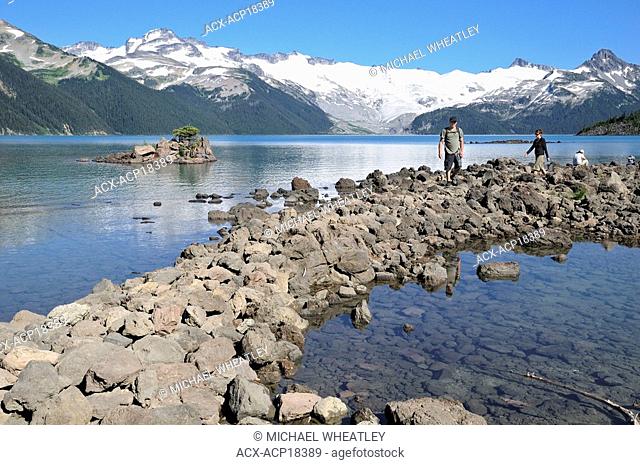 Couple hiking by Garibaldi Lake, Garibaldi Provincial Park, British Columbia, Canada