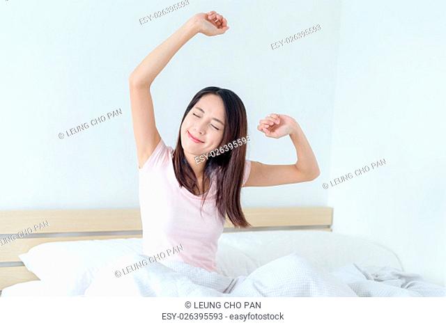 Woman Waking Up In Bed
